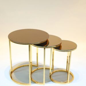 Three nesting round tables with gold metal frames and glass tops arranged by size