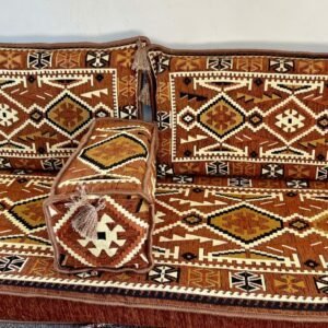 Traditional sofa set with brown and beige geometric patterns and intricate cushion designs.