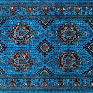 Intricate blue carpet with geometric and floral patterns in brown, black, and white.