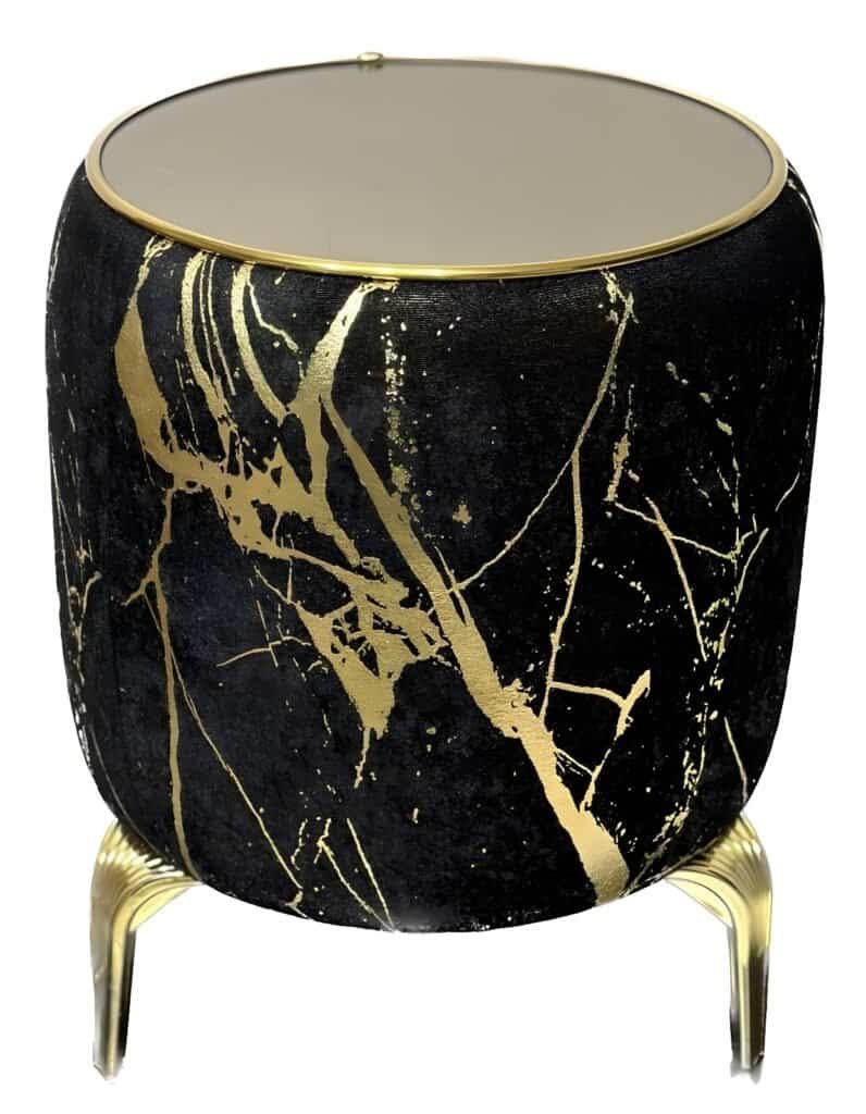 Round Side Table With Black Surface, Gold Marbled Patterns, Glass Top, And Metallic Gold Legs.