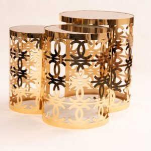 Luxury gold nesting table set with polished finish and floral cut-out design